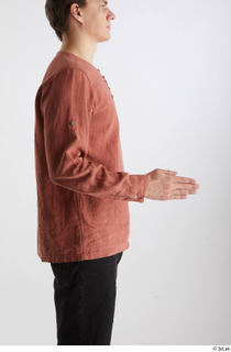 Brett  1 casual dressed orange linen shirt side view…